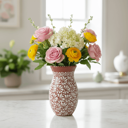 Handcrafted Talavera Vase | Brown & White Relief Pottery with pink roses, yellow ranunculus and white hydrangea in floral relief ceramic vase