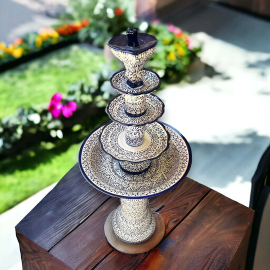 Handcrafted Talavera Fountain | Vibrant Mexican Artwork (4ft Height) on wooden table, hand-painted blue-white Talavera fountain
