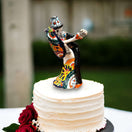 Handcrafted Talavera Cake Topper | Unique Hand-Painted Wedding Art - hand-painted colorful skull couple topper on white cake