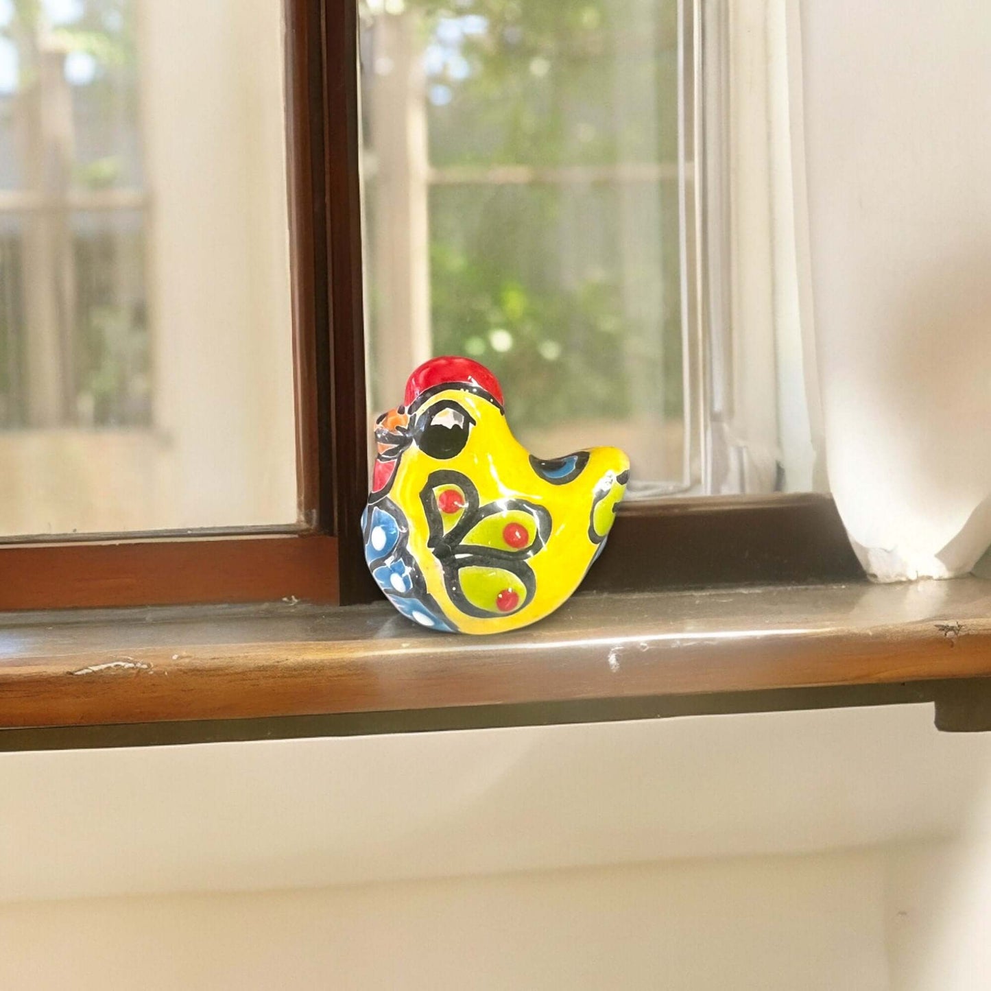 Set of 2 Hand-Painted Talavera Chicken Figurines | Mexican Ceramic Chickens - vibrant yellow hand-painted Talavera chicken figurine on windowsill