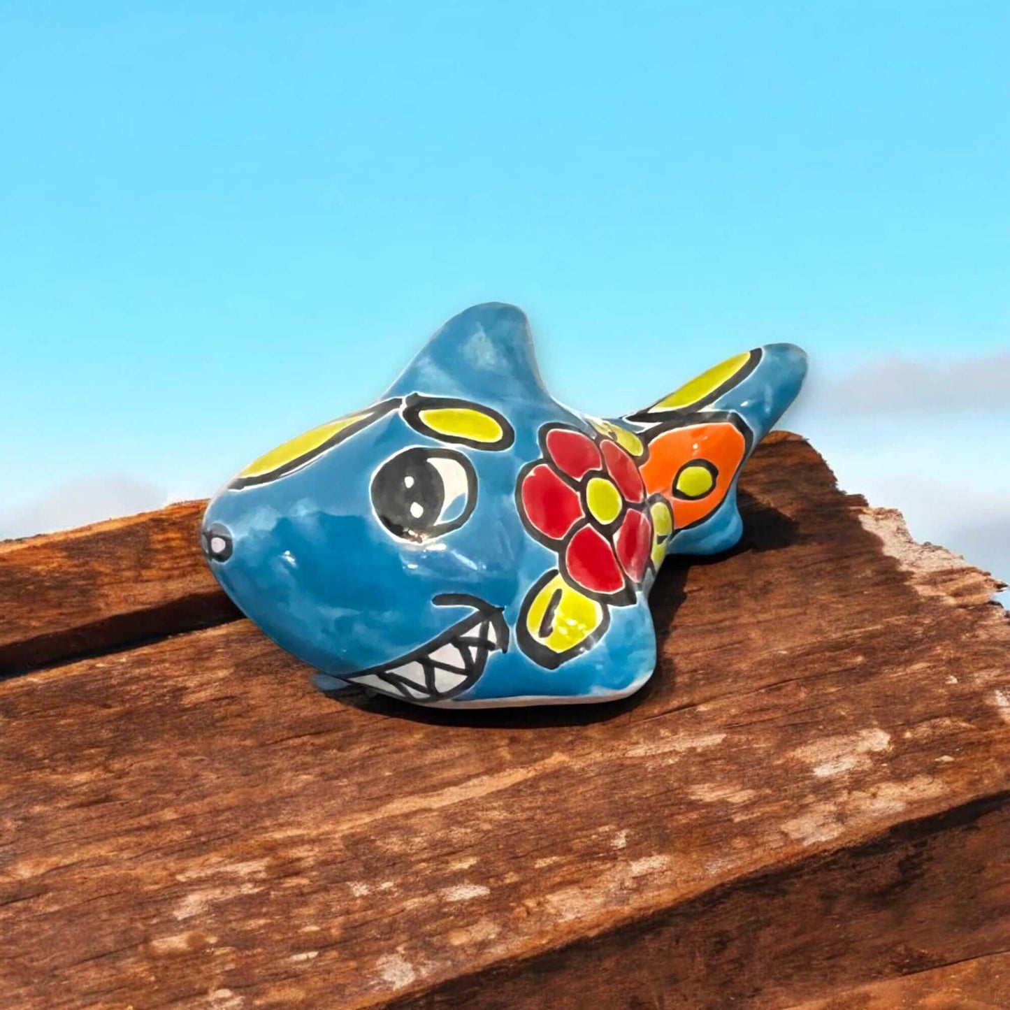 Colorful Talavera Shark Figurine | Handcrafted Mexican Pottery Decor hand-painted blue ceramic shark with floral motif on wooden plank