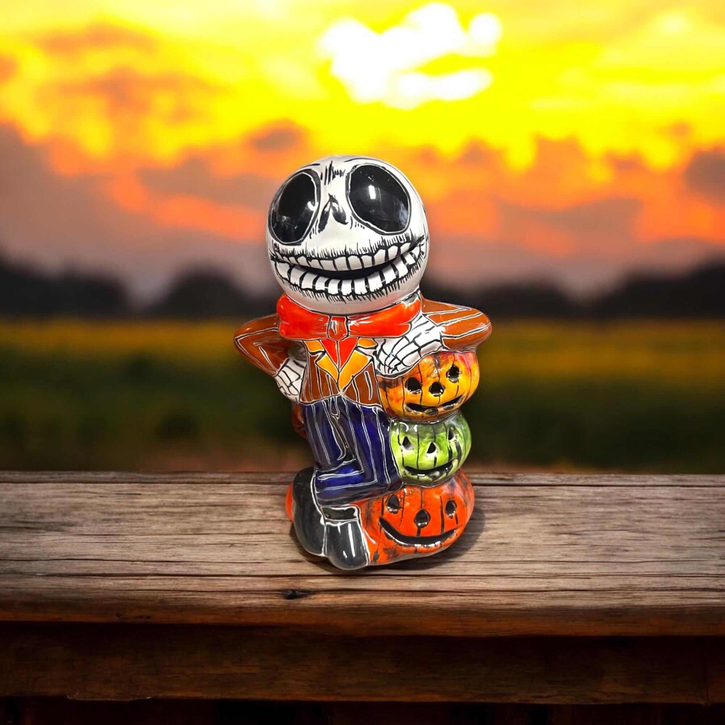 Handcrafted Talavera Skeleton Statue | Vibrant Day of the Dead Calavera Decor - hand-painted Mexican Talavera calavera holding colorful jack-o-lanterns