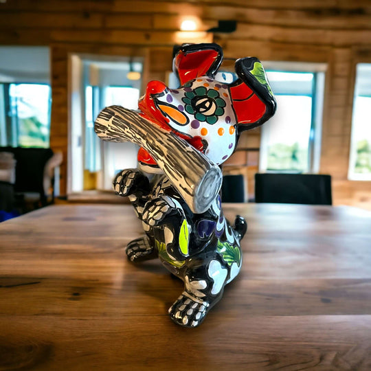 Talavera Day of the Dead Dog | Handcrafted Mexican Pottery Statue (Medium) colorful hand-painted ceramic skull dog statue on wooden table