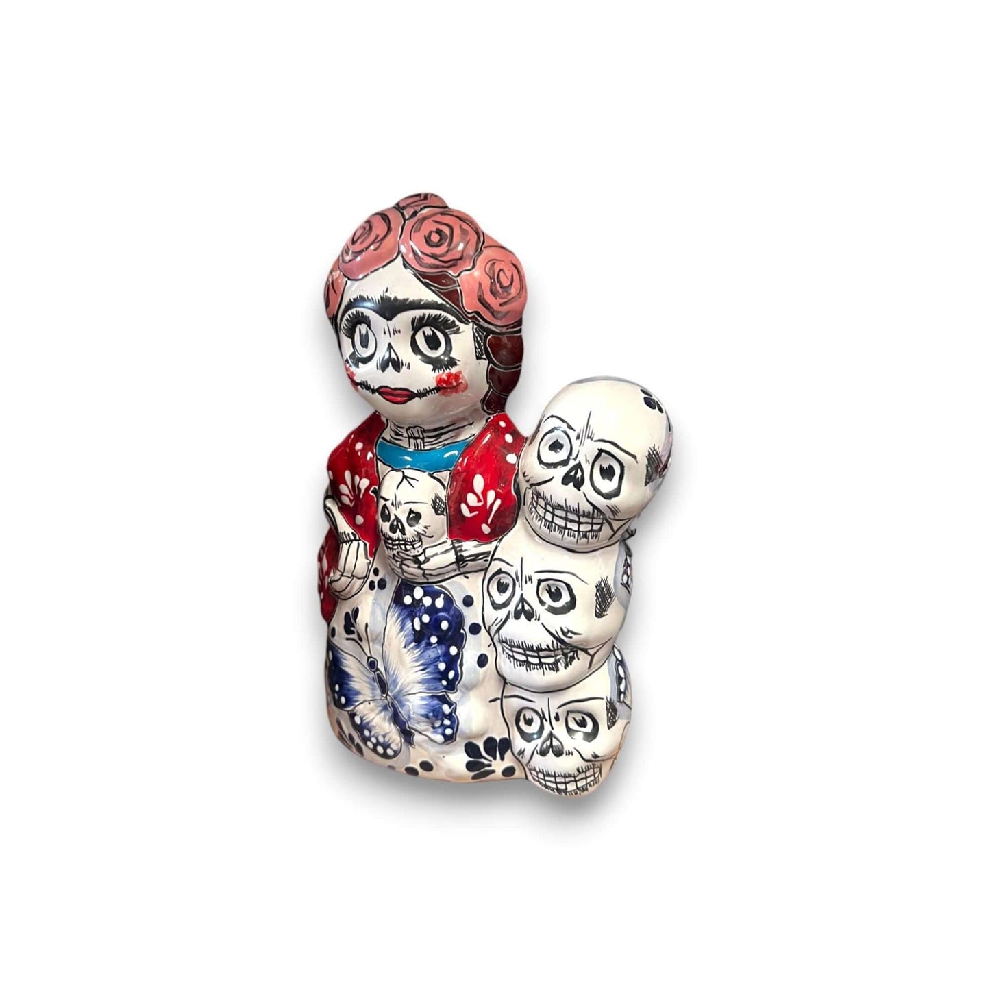 Handcrafted Talavera Frida Statue | Colorful Day of the Dead Calavera Skull Decor handcrafted hand-painted Talavera Frida with stacked skulls and floral motifs