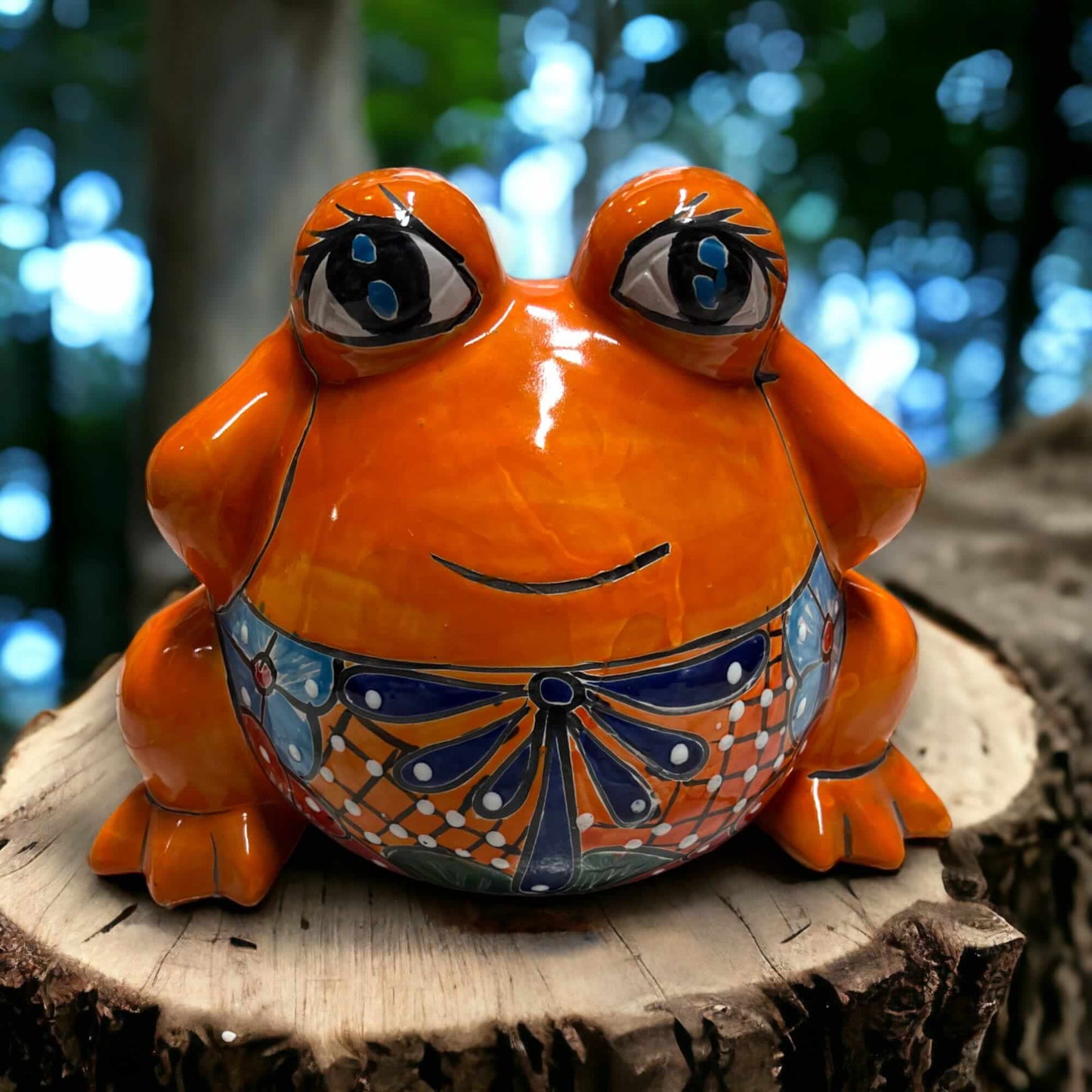 Colorful Talavera Frog Planter | Handcrafted Mexican Pottery Statue (Medium) - bright orange hand-painted ceramic planter on a tree stump