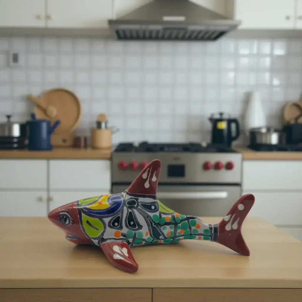 Vibrant Talavera Shark Figurine | Handcrafted Mexican Decor hand-painted colorful shark figurine with floral and leaf motifs on kitchen counter