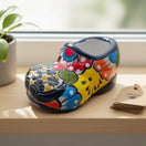 Vibrant Talavera Shoe Planter | Handcrafted Mexican Pottery - colorful hand-painted ceramic shoe planter on windowsill