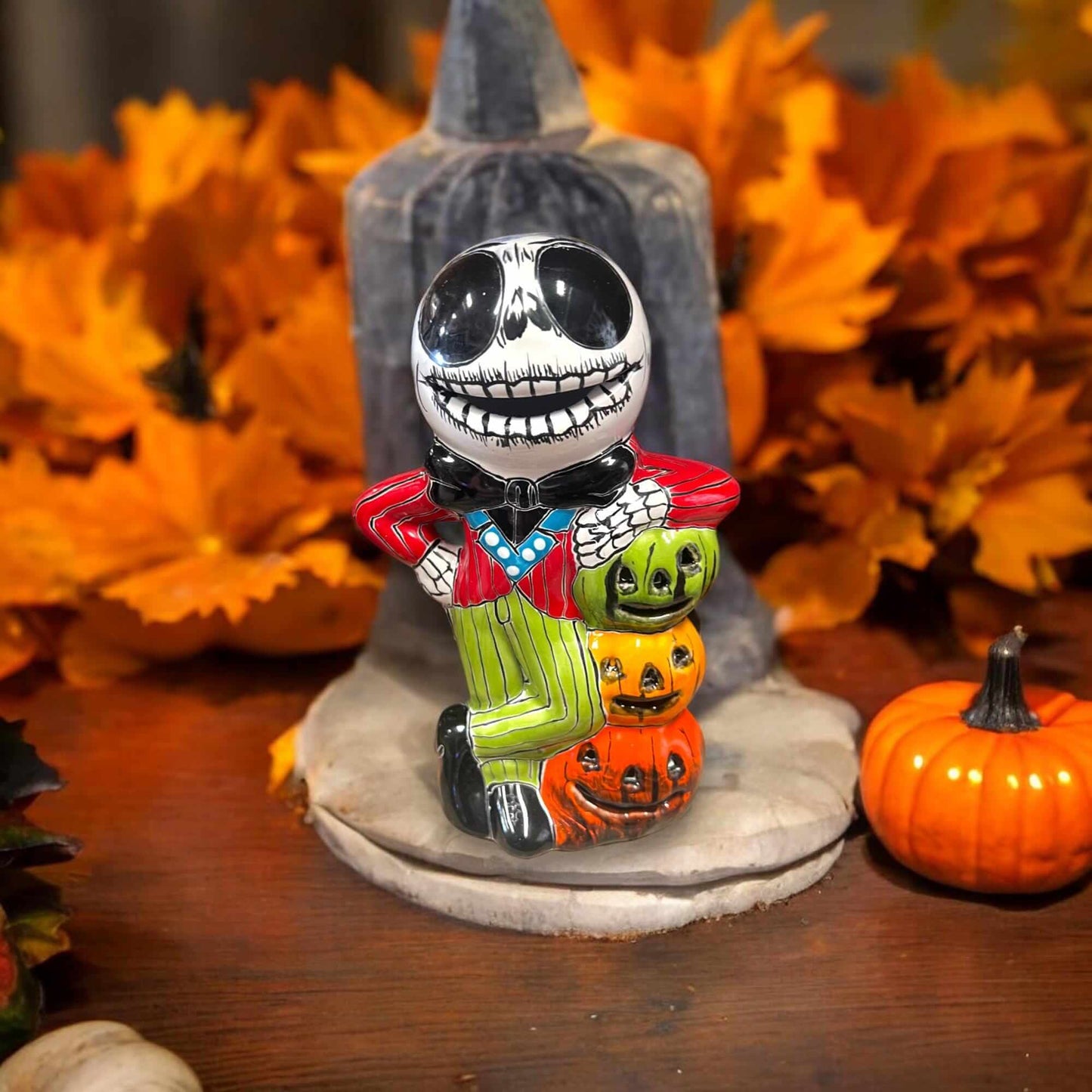 Handcrafted Talavera Skeleton Statue | Vibrant Day of the Dead Calavera Decor - hand-painted Talavera calavera statue with pumpkins and autumn leaves