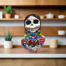 Vibrant Talavera Skeleton Woman Statue | Handcrafted Day of the Dead Decor - hand-painted Talavera skeleton woman on shelf, colorful floral details