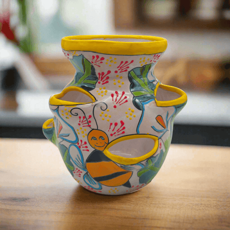 Handcrafted Talavera Strawberry Pot | Bumble Bee Garden Planter - bright yellow rimmed ceramic strawberry pot with bumble bee motifs and colorful handpainted leaves