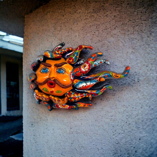 Handcrafted Talavera Sun Face | Colorful Mexican Wall Art — hand-painted Talavera sun face with mustache blowing a kiss, vibrant kiln-fired colors
