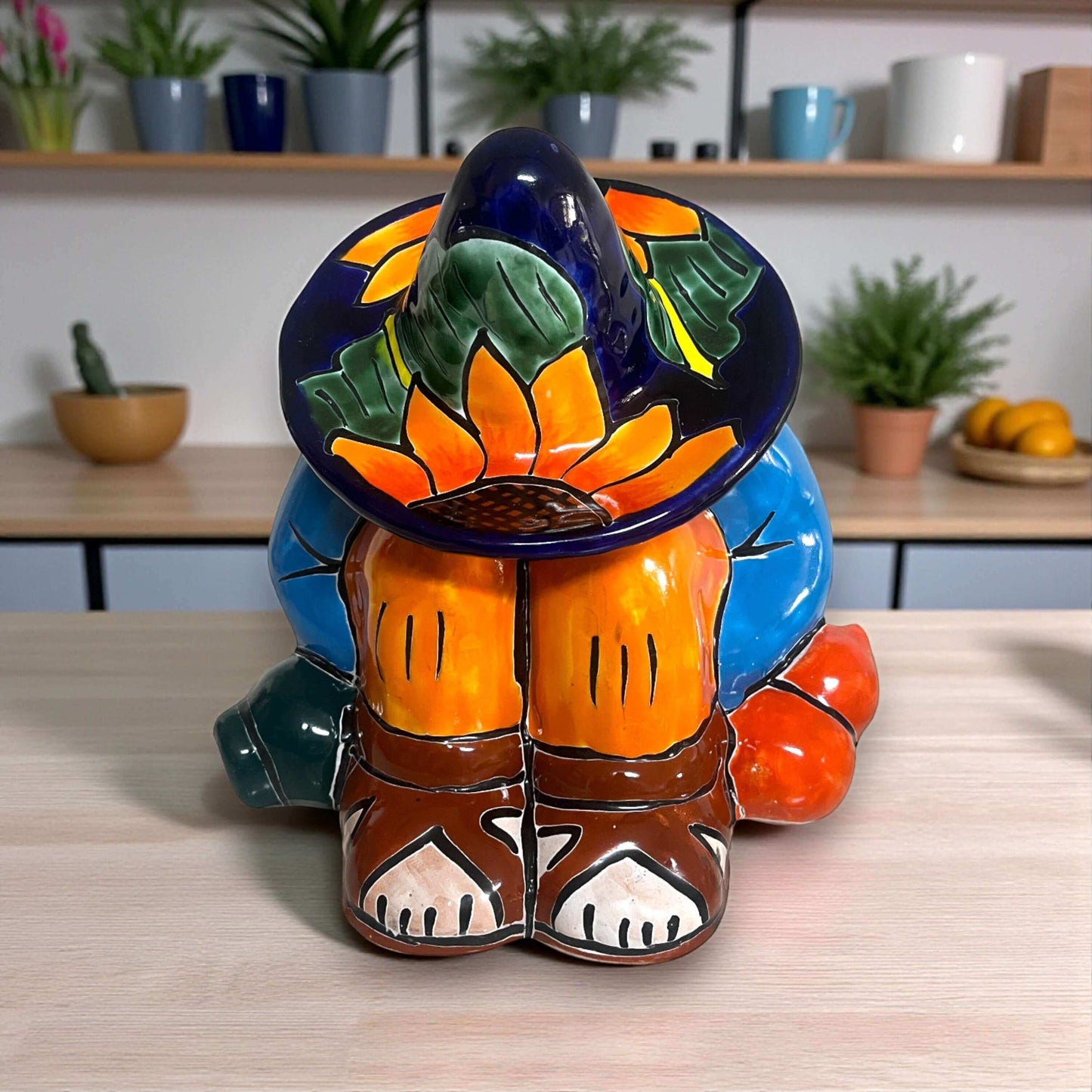 Talavera Sunflower Panchito Canister | Handcrafted Mexican Art - colorful handcrafted Talavera panchito with sunflower sombrero on kitchen counter