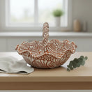 Terracotta & White Talavera Basket | Handcrafted Ceramic Bowl on wooden table with twisted handle and floral white patterns