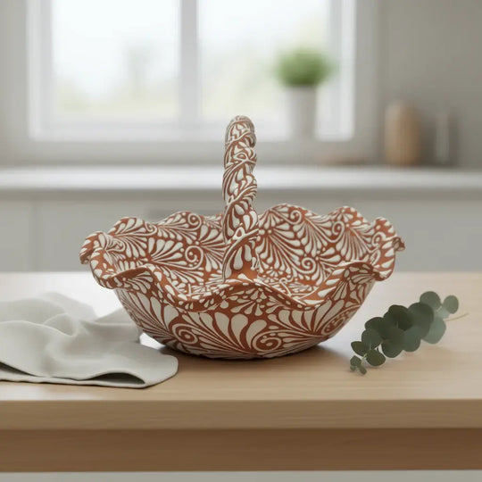 Terracotta & White Talavera Basket | Handcrafted Ceramic Bowl on wooden table with twisted handle and floral white patterns