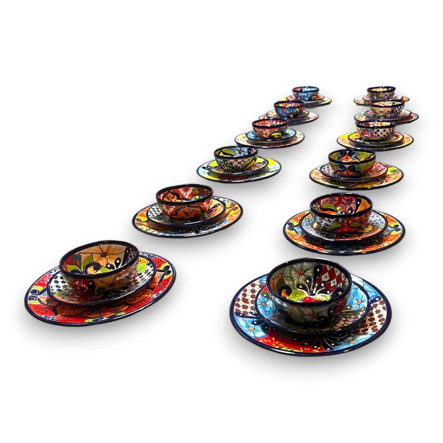 36-Piece Talavera Dinnerware Set | Handmade Mexican Plates & Bowls — hand-painted colorful Talavera plates and bowls arranged in rows