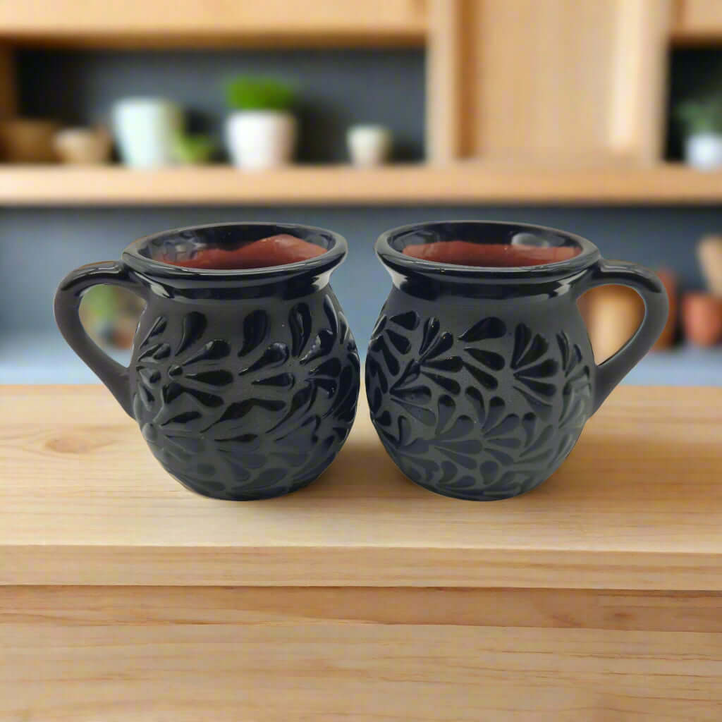 Black Talavera Jarrito Mug | Handmade Mexican Clay Coffee Cup - pair of hand-painted black clay jarrito mugs with carved floral pattern