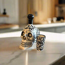 Handmade Skull Decanter Set | Black & White Mexican Barware - hand-blown skull decanter and matching shot glass on marble counter