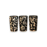 Handmade Skull Decanter Set | Black & White Mexican Barware - three hand-blown black and white shot glasses with floral skull-inspired pattern