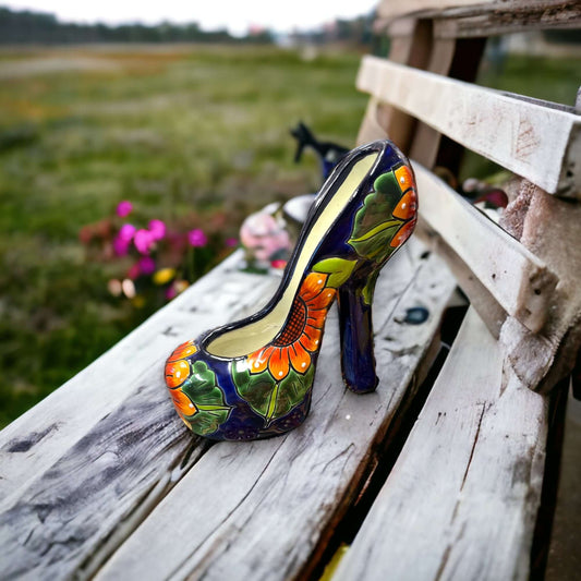 Colorful Talavera High Heel Statue | Handmade Mexican Home Decor - hand-painted Talavera ceramic heel with floral design on rustic bench