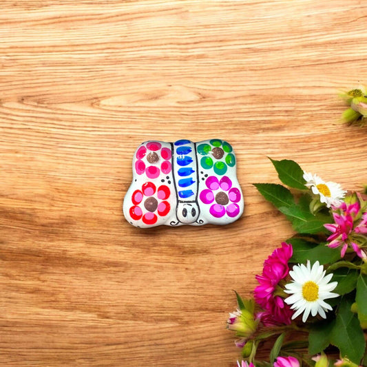 Handmade Guerrero Butterfly Jewelry Box | Mexican Ceramic Earring Holder - hand-painted colorful butterfly earring holder on wooden surface with flowers