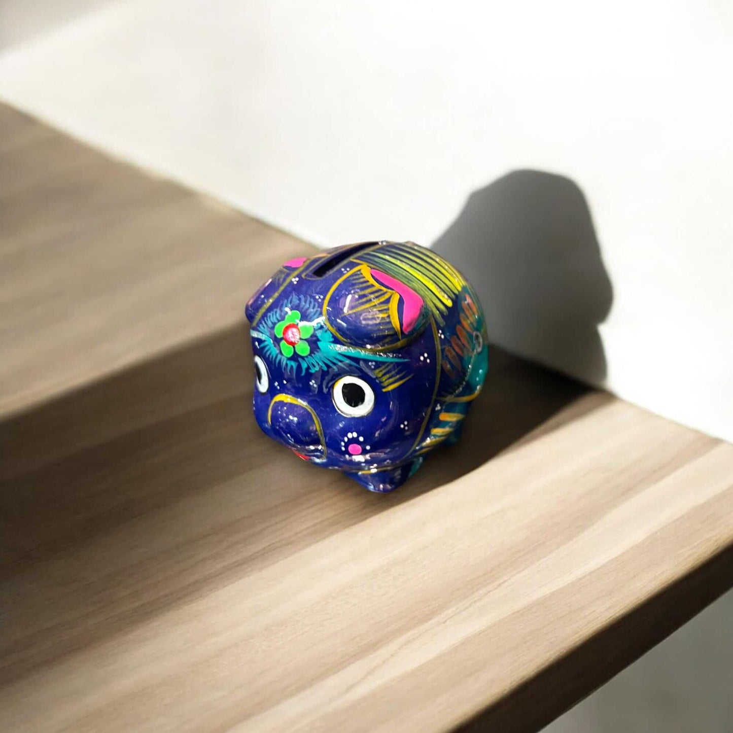 Handmade Guerrero Piggy Bank | Mexican Painted Ceramic Coin Bank (Small) on wooden shelf, hand-painted blue Guerrero pottery piggy bank