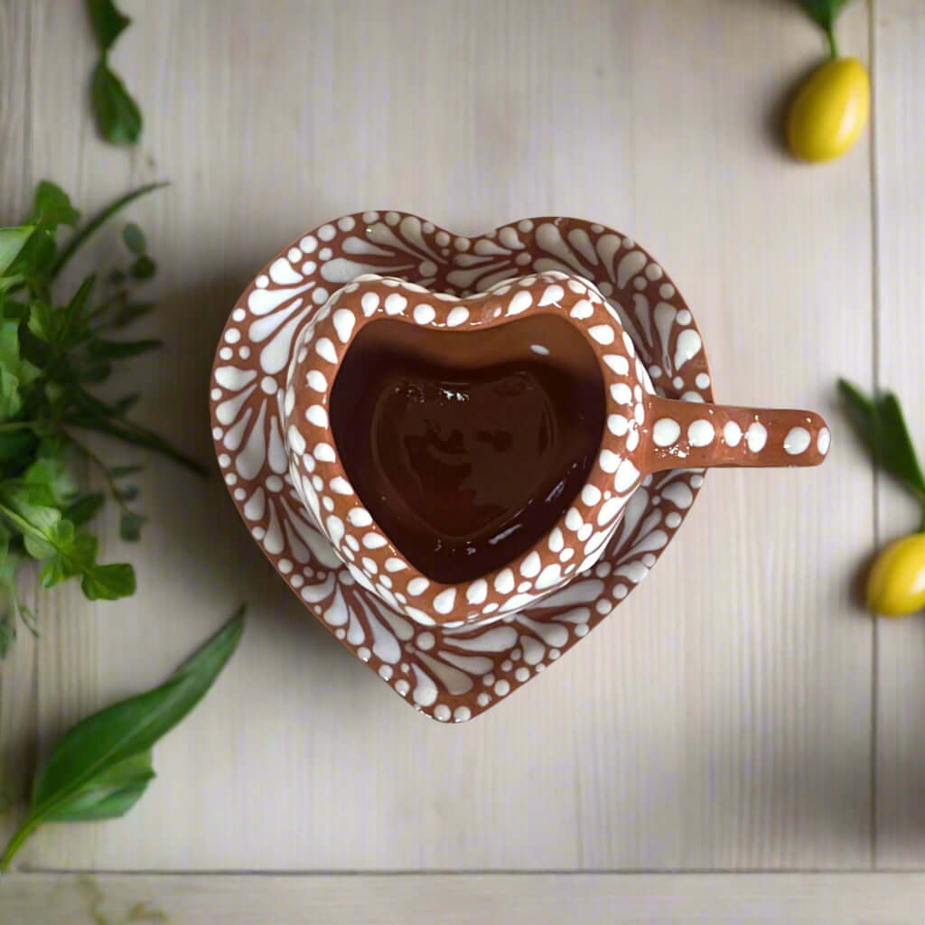 Heart Mug & Pitcher Set | Handmade Mexican Pottery (9-Pieces) - top view of hand-painted heart mug with saucer, brown and white Talavera design