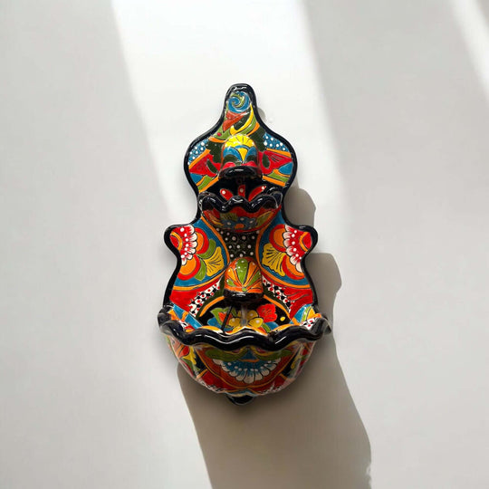 Handmade Mexican Talavera Wall Fountain | Authentic Art Decor (Large) colorful hand-painted Talavera wall fountain mounted on white wall