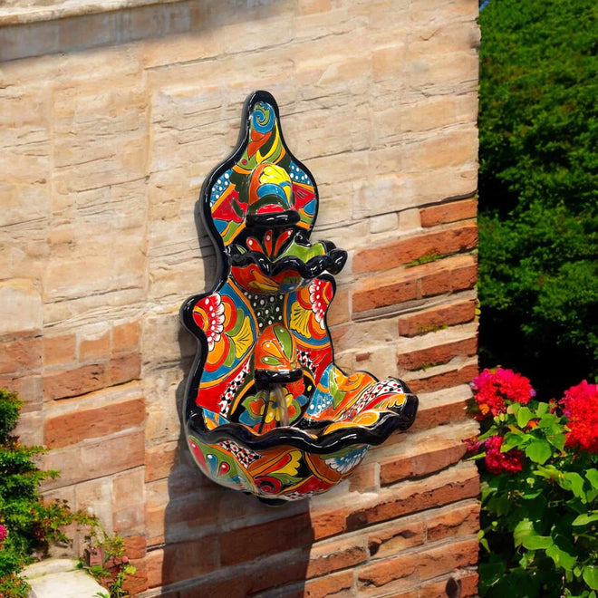 Handmade Mexican Talavera Wall Fountain | Authentic Art Decor (Large) vibrant hand-painted ceramic wall fountain mounted on brick
