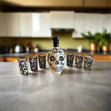 Handmade Skull Decanter Set | Black & White Mexican Barware — hand-blown skull decanter with six matching black and white shot glasses on kitchen counter