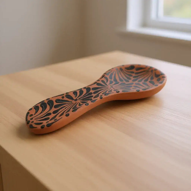 Colorful Talavera Spoon Rest | Handmade Mexican Barro Holder with hand-painted blue and terracotta floral pattern on wooden countertop