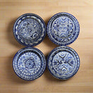 Talavera Dinnerware Set | 20-Piece Blue & White Tableware for 4 — four hand-painted blue and white Talavera bowls on wooden table