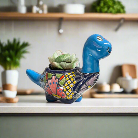Talavera Brachiosaurus Planter | Colorful Mexican Succulent Pot on kitchen counter, handmade Talavera dinosaur succulent pot