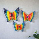 Set of 3 Talavera Butterfly Wall Hangings | Handmade Ceramic Decor vibrant hand-painted Mexican ceramic butterflies on textured wall