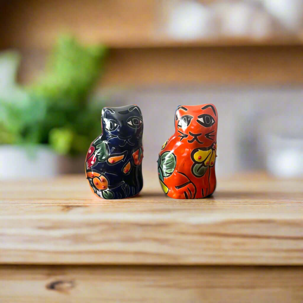 Set of 2 Talavera Cat Statues | Small Handmade Mexican Figurines - hand-painted orange and blue Talavera cat figurines on wooden table