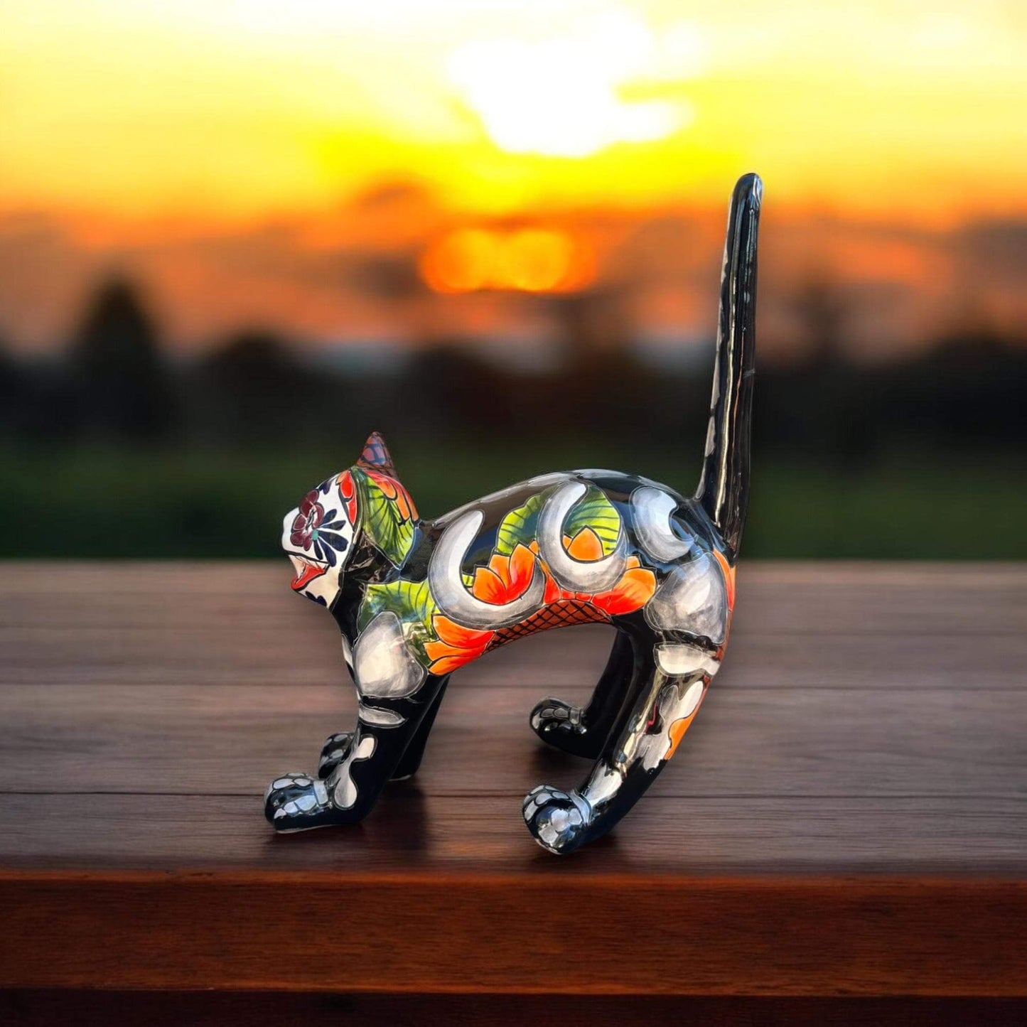 Handmade Talavera Arched Cat Statue | Day of the Dead Ceramic Cat Art - hand-painted Mexican Talavera cat sculpture at sunset