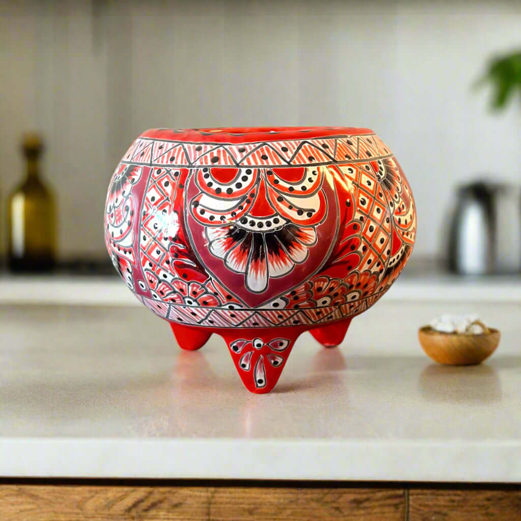 Handmade Talavera Molcajete Planter | Colorful Mexican Flower Pot - hand-painted red three-legged Talavera planter on kitchen counter