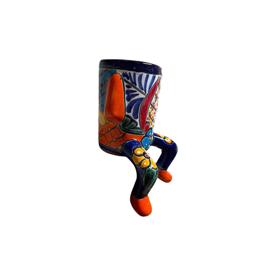 Talavera Person Planter | Table Edge Pot with Arms and Legs - hand-painted Mexican Talavera planter sitting on kitchen counter edge