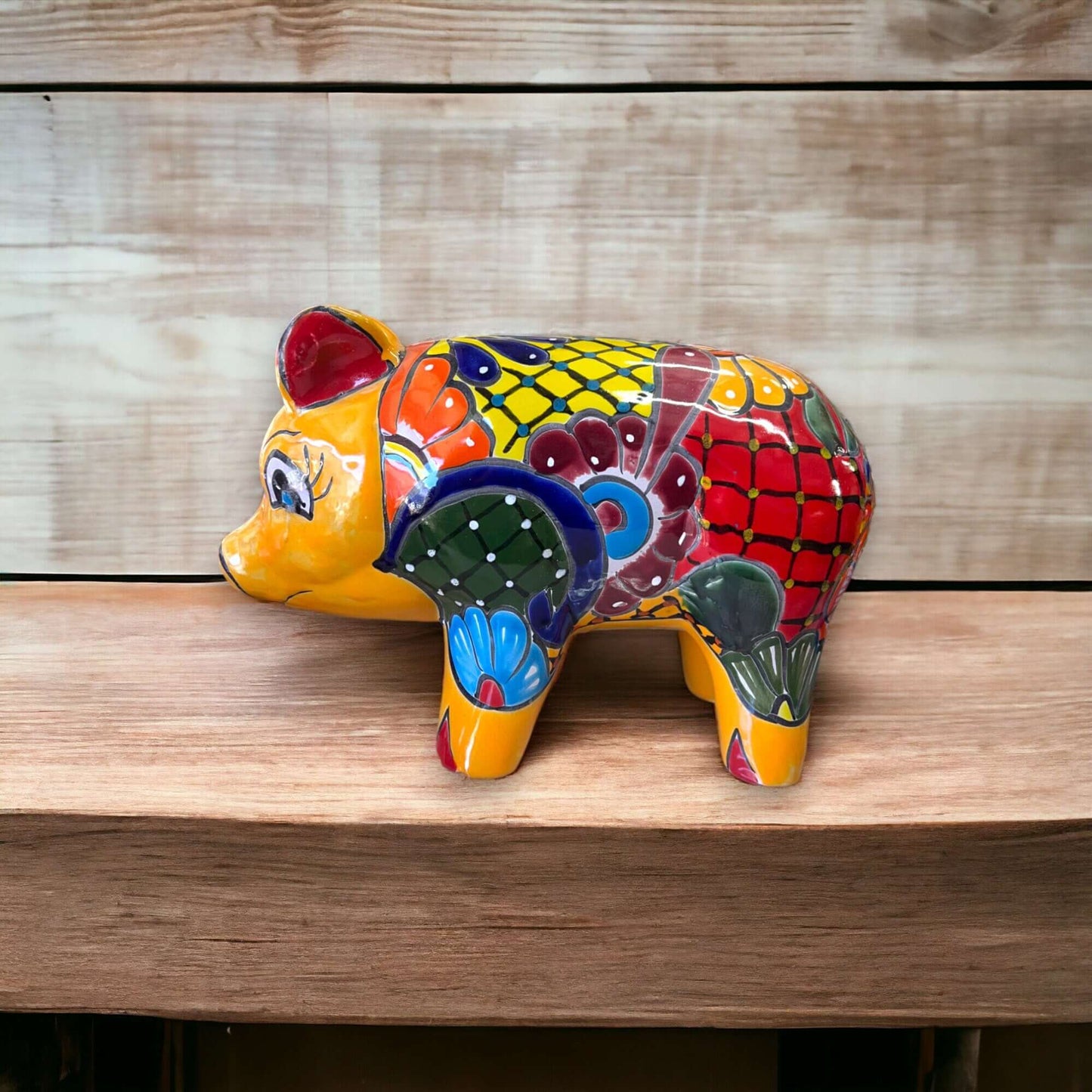 Vibrant Talavera Pig Statue | Colorful Handmade Mexican Animal Pottery (Medium) on wooden shelf, hand-painted Talavera pig from Guanajuato
