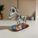 Colorful Talavera Skeleton Dog | Handmade Mexican Artistry - hand-painted Talavera skeleton dog statue on floral base, kiln-fired lead-free glaze