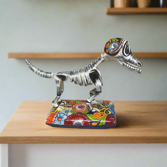Colorful Talavera Skeleton Dog | Handmade Mexican Artistry - hand-painted Talavera skeleton dog statue on floral base, handcrafted in Guanajuato, Mexico