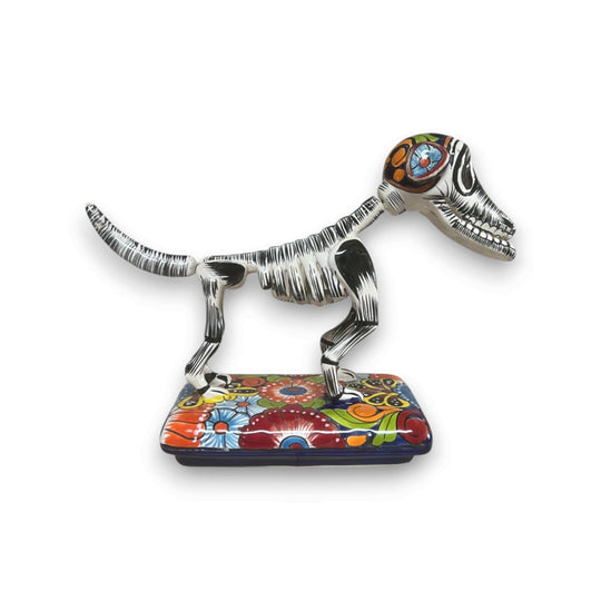 Colorful Talavera Skeleton Dog | Handmade Mexican Artistry hand-painted Talavera skeleton dog statue on floral base, kiln-fired lead-free glaze