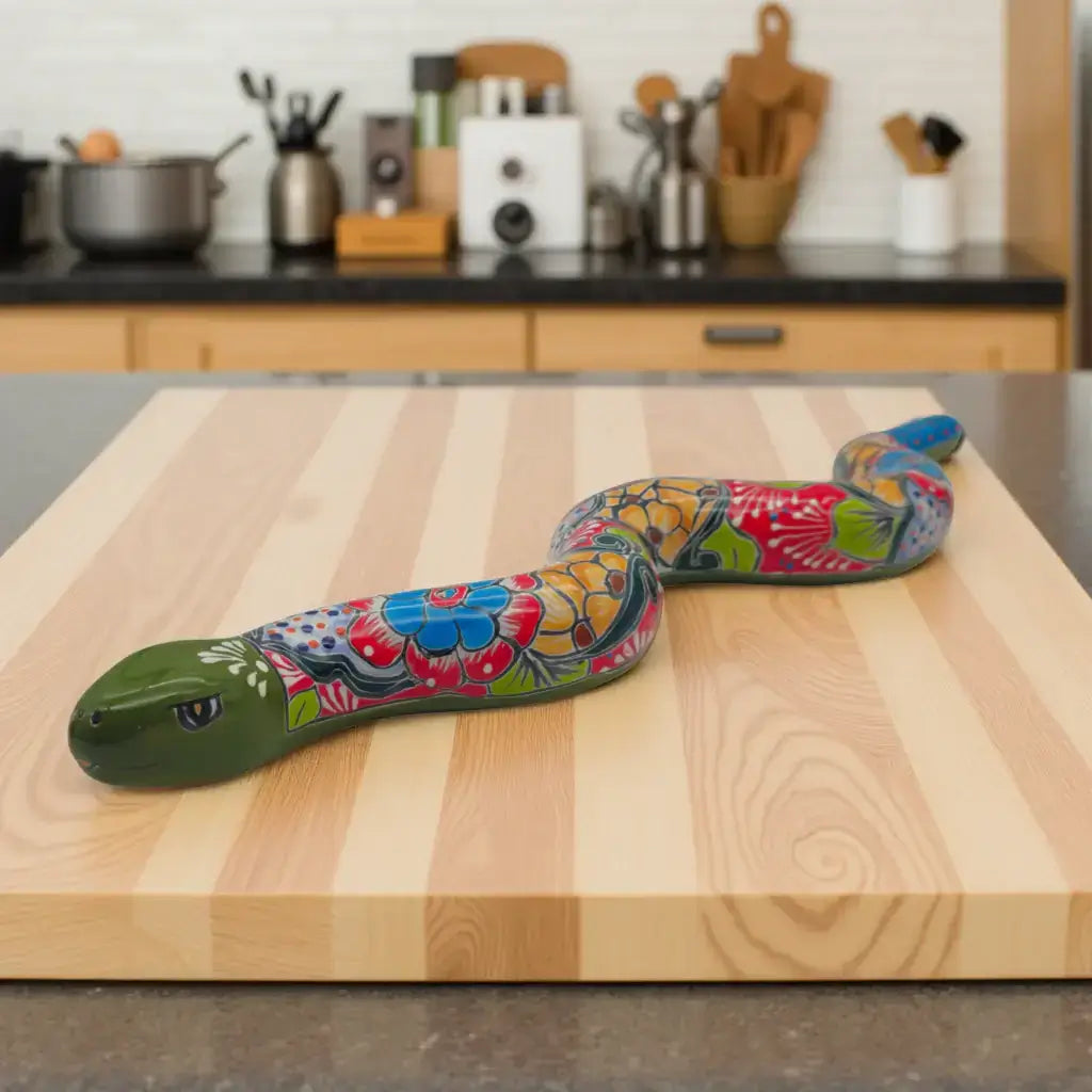 Handmade Talavera Snake Statue | Hand-Painted Mexican Decor on wooden board in modern kitchen, colorful hand-painted ceramic snake