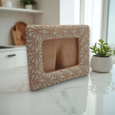 Handmade Talavera Photo Frame | Terracotta & White Design showcasing terracotta base with white hand-painted floral details on kitchen counter