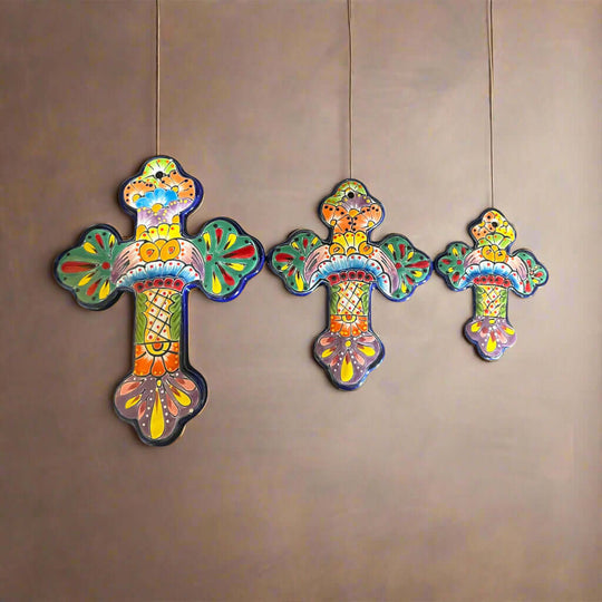 Set of 3 Talavera Wall Crosses | Handmade Mexican Ceramic Art - colorful hand-painted Talavera floral crosses hanging on a wall