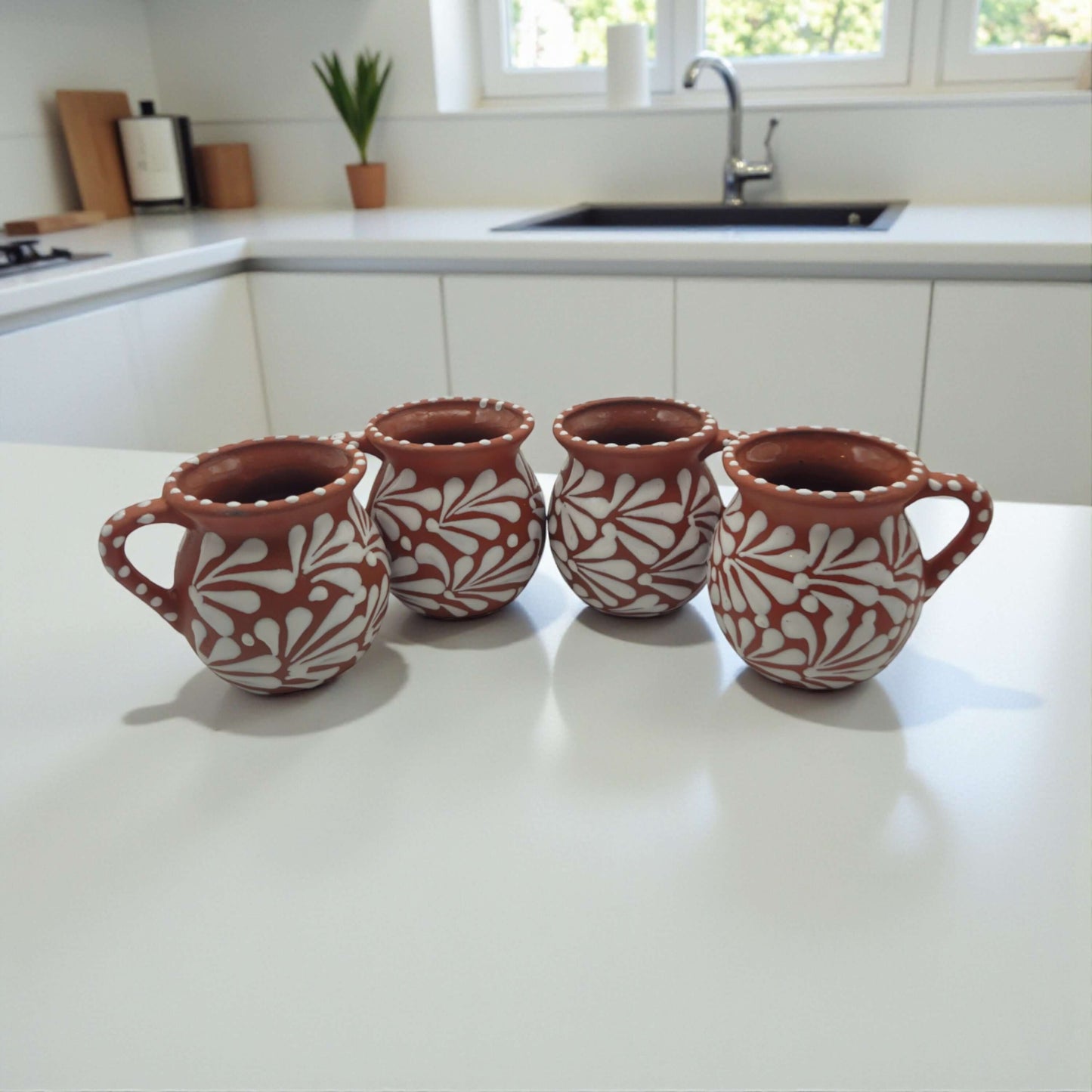 Terracotta Jarrito Mug | Handmade Mexican Relief Pottery Cup - set of four hand-painted terracotta jarrito mugs with white raised floral relief and dotted rims