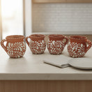 Terracotta Jarrito Mug | Handmade Mexican Relief Pottery Cup on kitchen table