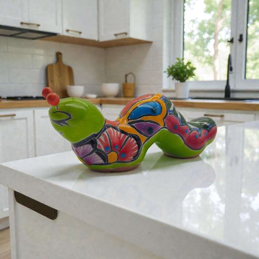 Colorful Talavera Caterpillar | Mexican Ceramic Figurine hand-painted glossy folk art caterpillar on white kitchen island