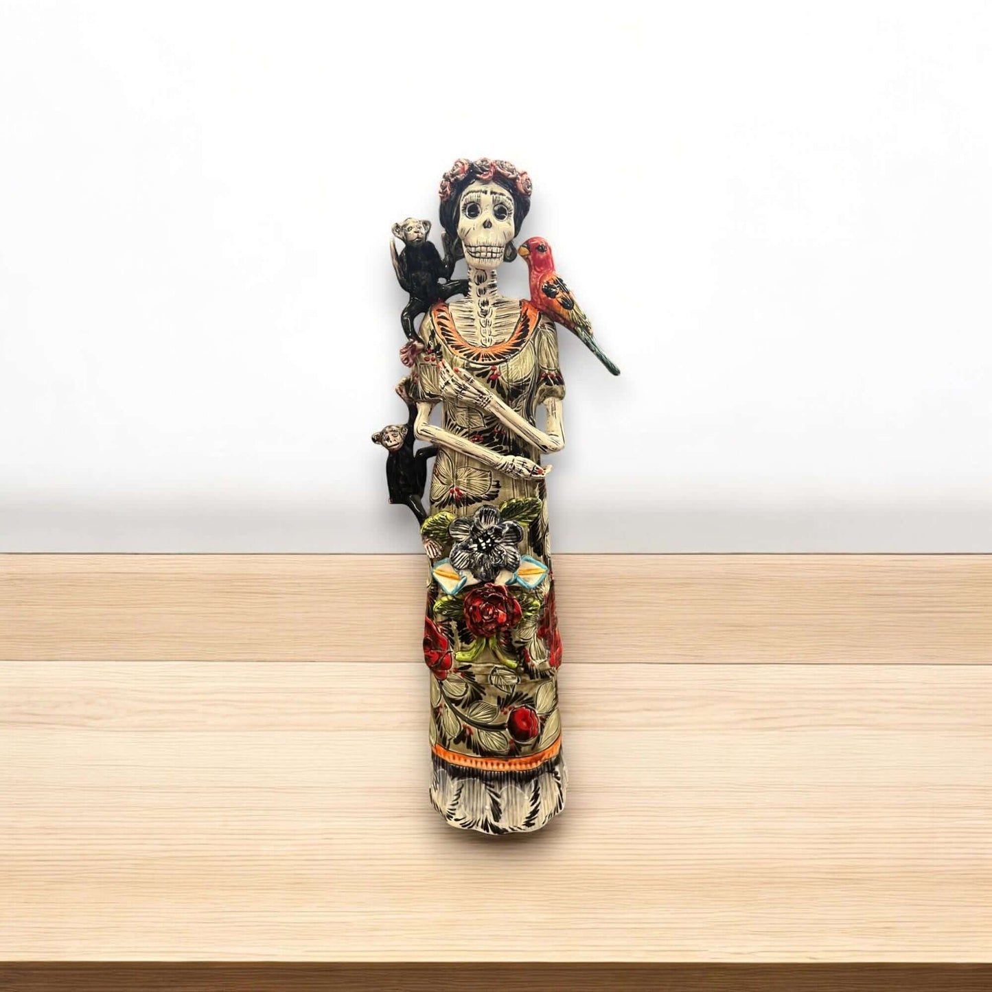 Talavera Catrina Figurine | Day of the Dead Skeleton with Monkey & Bird – hand-painted Talavera Catrina with parrot, monkey and floral gown