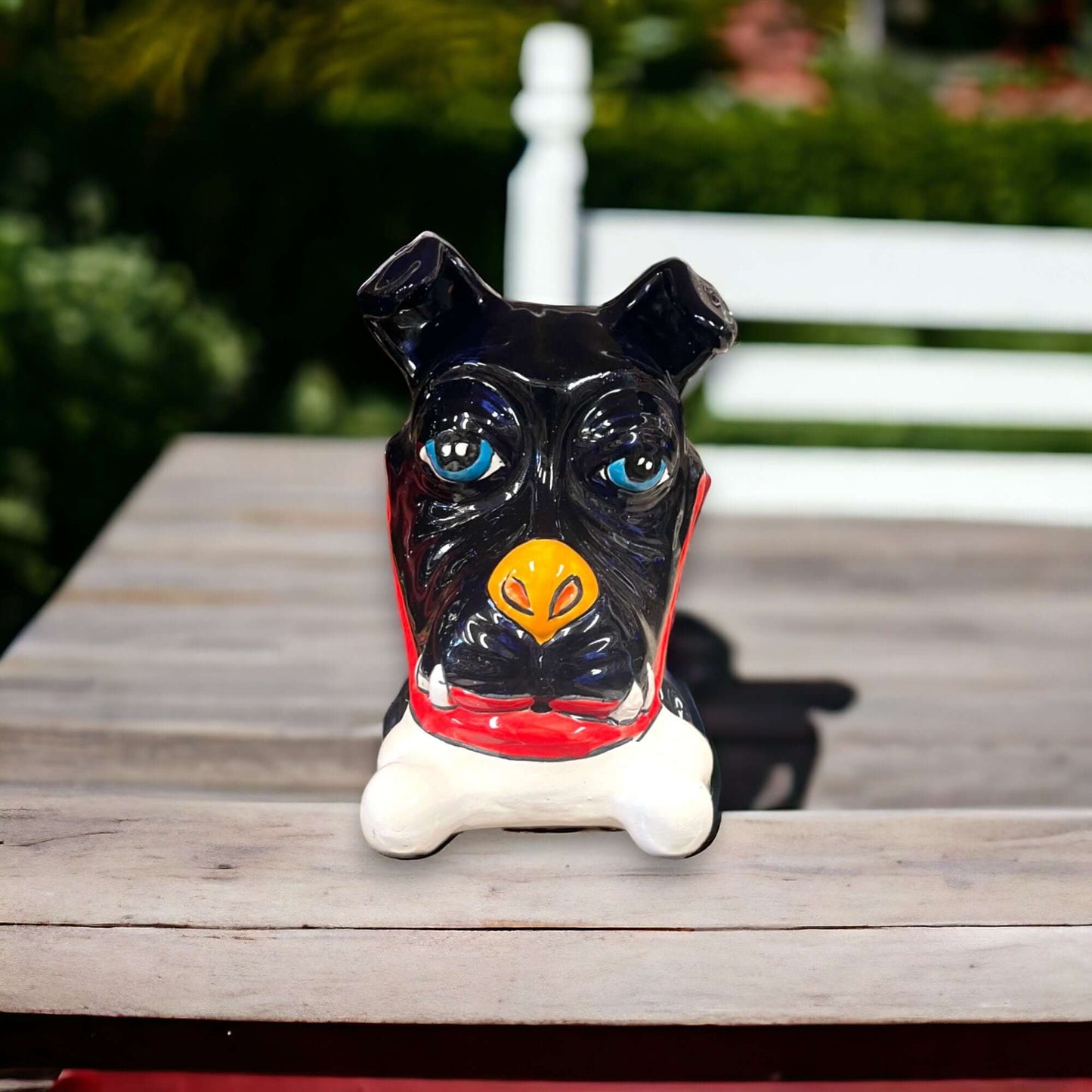 Handpainted Talavera Ceramic Large Laying Dog Decor with Bone - black hand-painted Talavera dog figurine on table