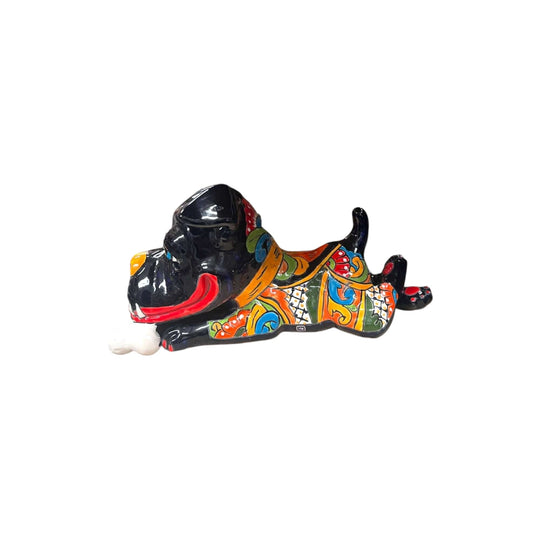Handpainted Talavera Ceramic Large Laying Dog Decor with Bone displayed on wooden table, colorful hand-painted Mexican Talavera design